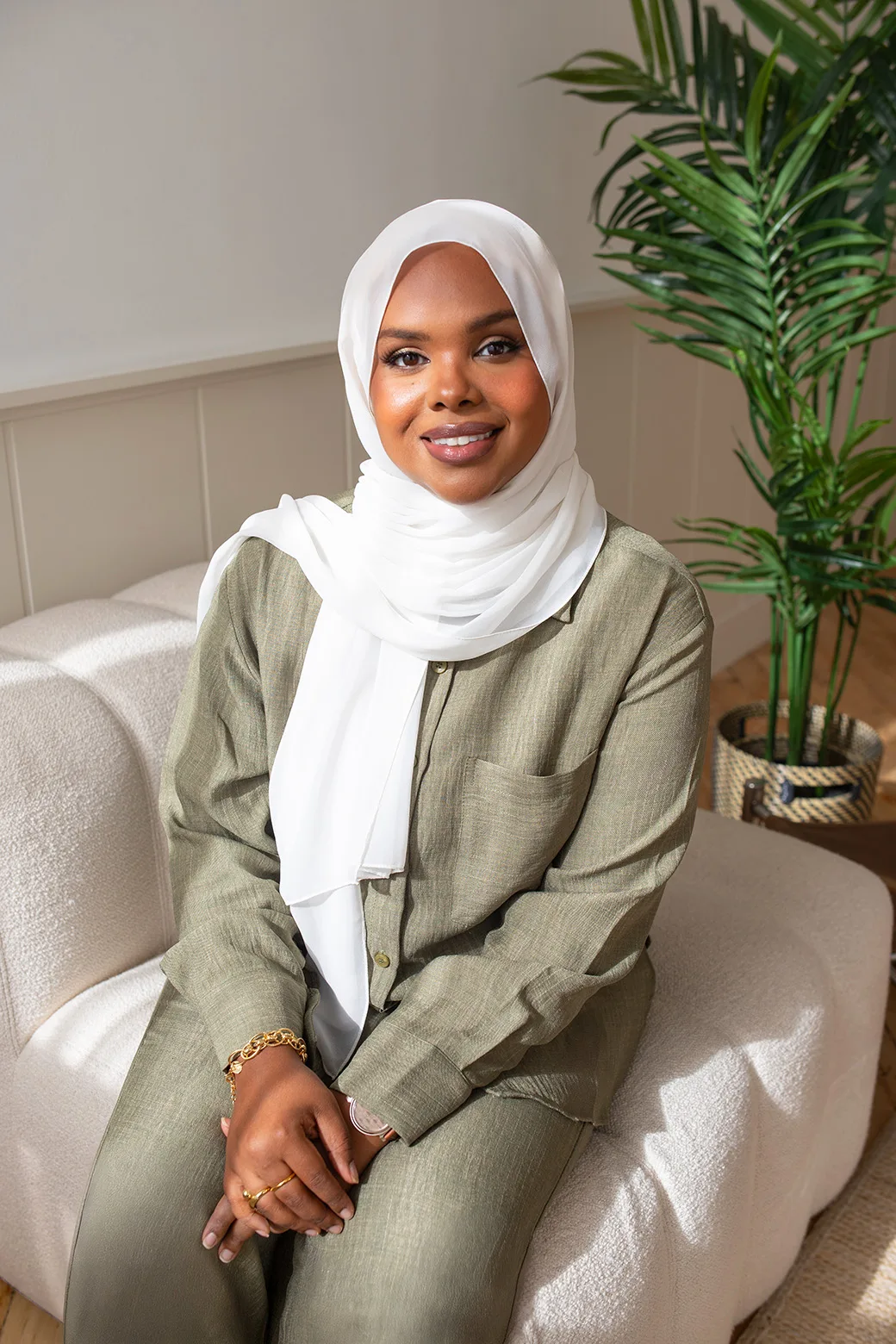Warm portrait of a therapist in a bright, welcoming setting