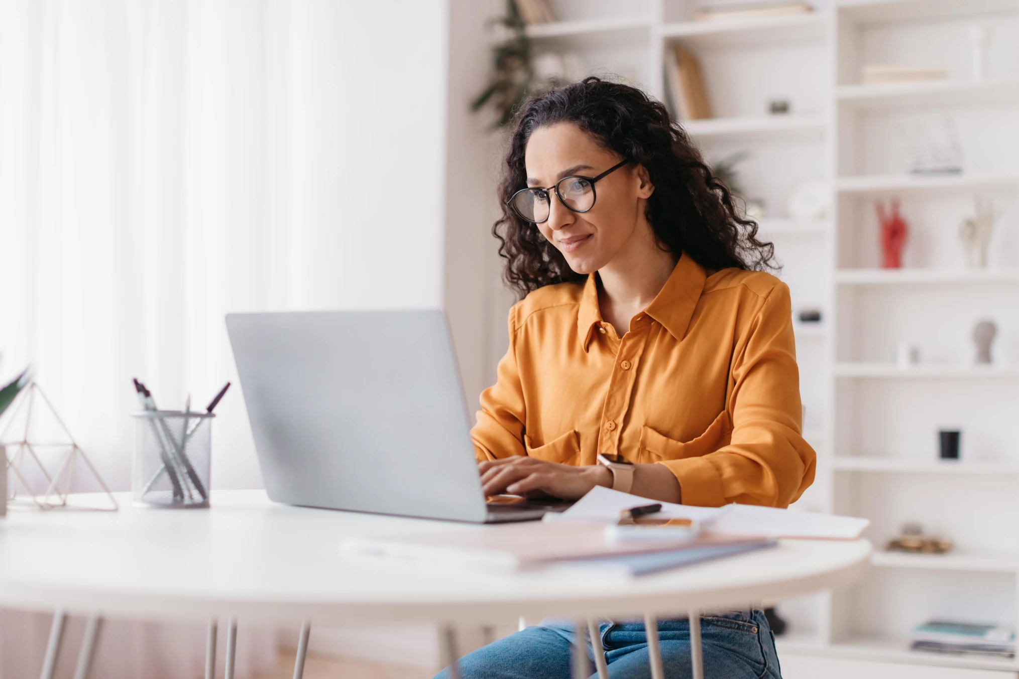 A therapist reviewing client intake information on a laptop